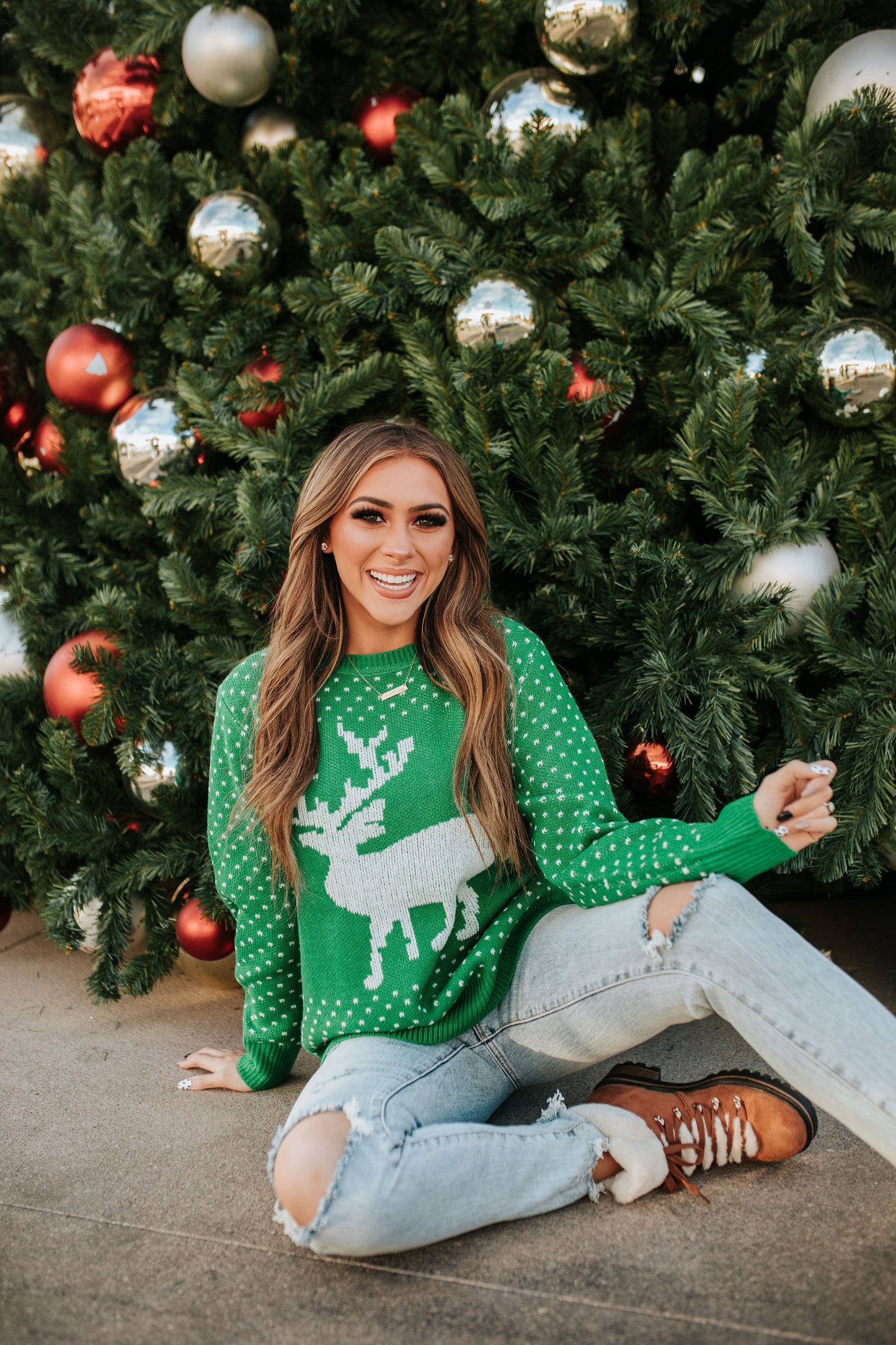 THE CHRISTMAS REINDEER SWEATER IN HOLLY GREEN