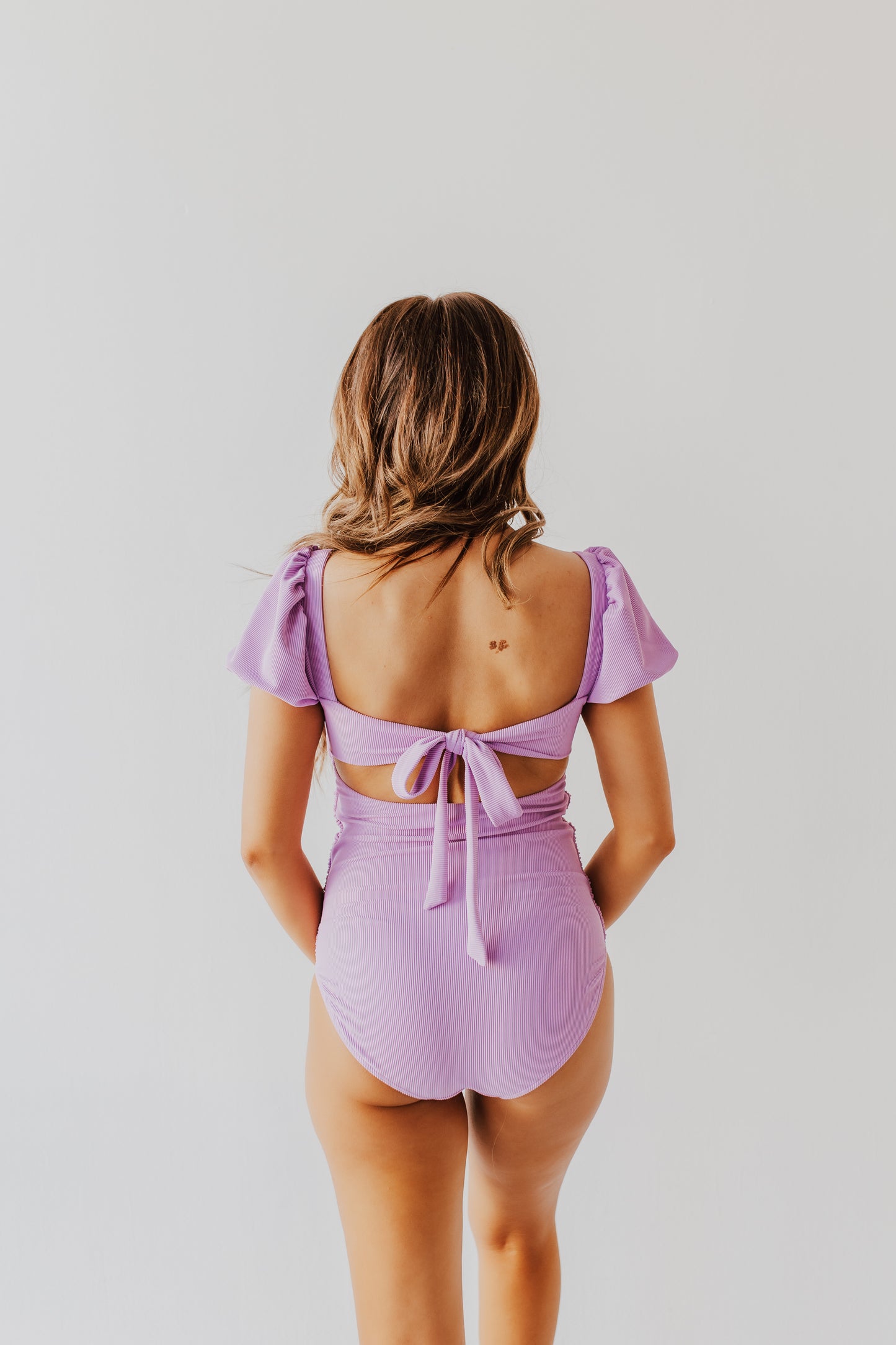 PUFF SLEEVE ONE PIECE IN RIBBED LAVENDER BY PINK DESERT