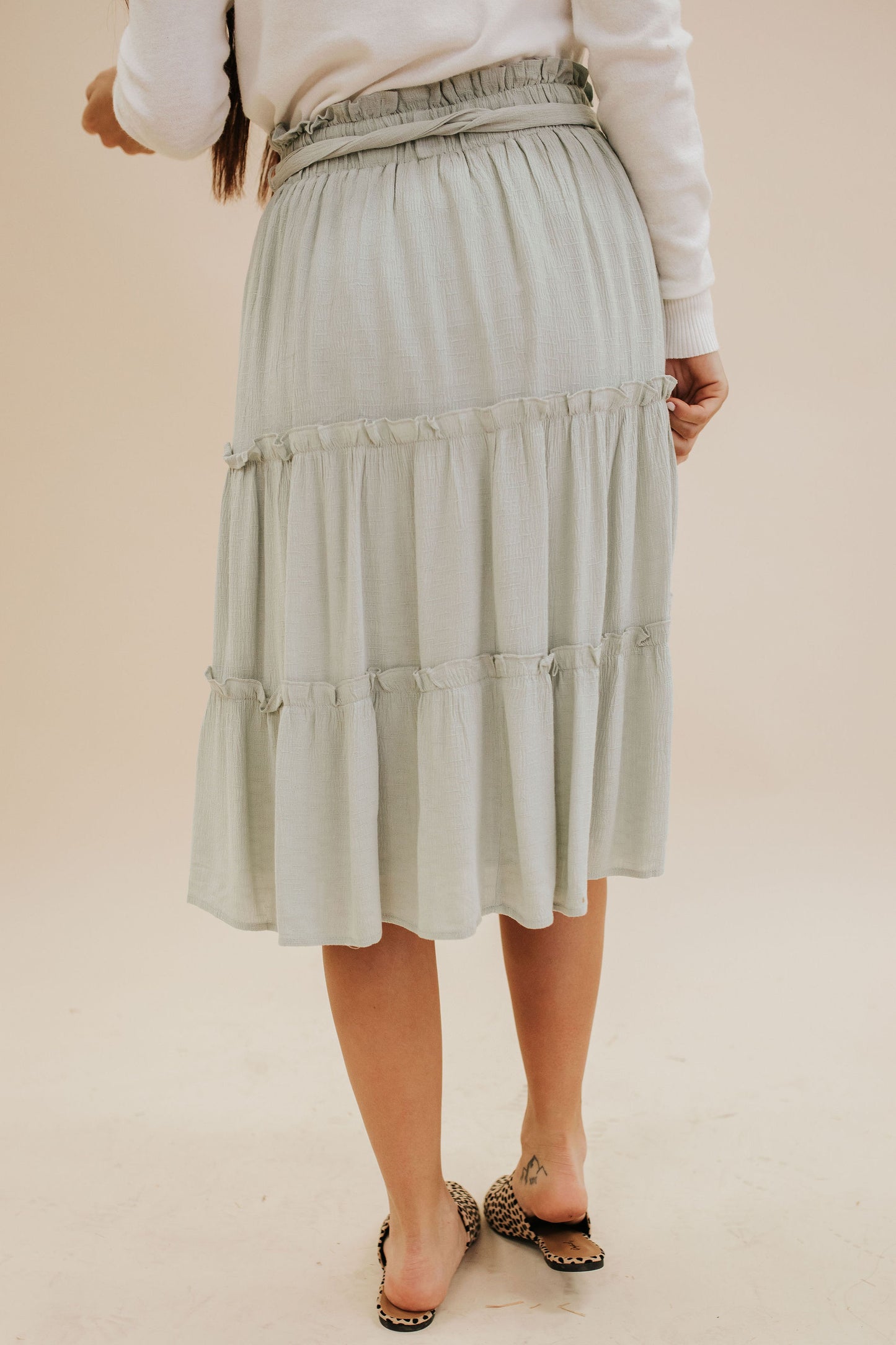 THE AFTERGLOW RUFFLE SKIRT IN LIGHT SAGE